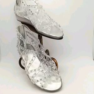 Bedazzled Stuart Weitzman clear jelly sandals.